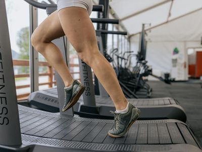 Blurred motion of a person running on a treadmill.